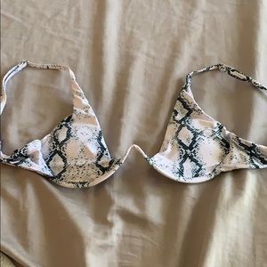 A snakeskin bikini top